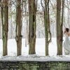 A woman in a ball gown outdoors in the snow.